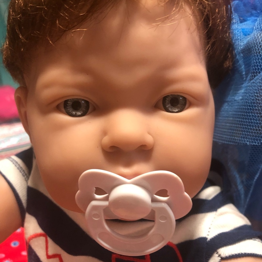 Beautiful and adorable baby boy doll